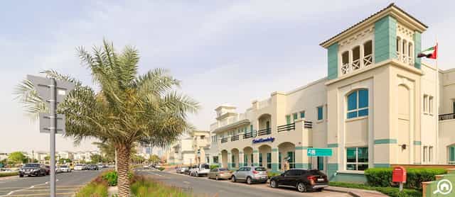 Event venue in Dubai Knowledge Park with modern architecture and palm trees.