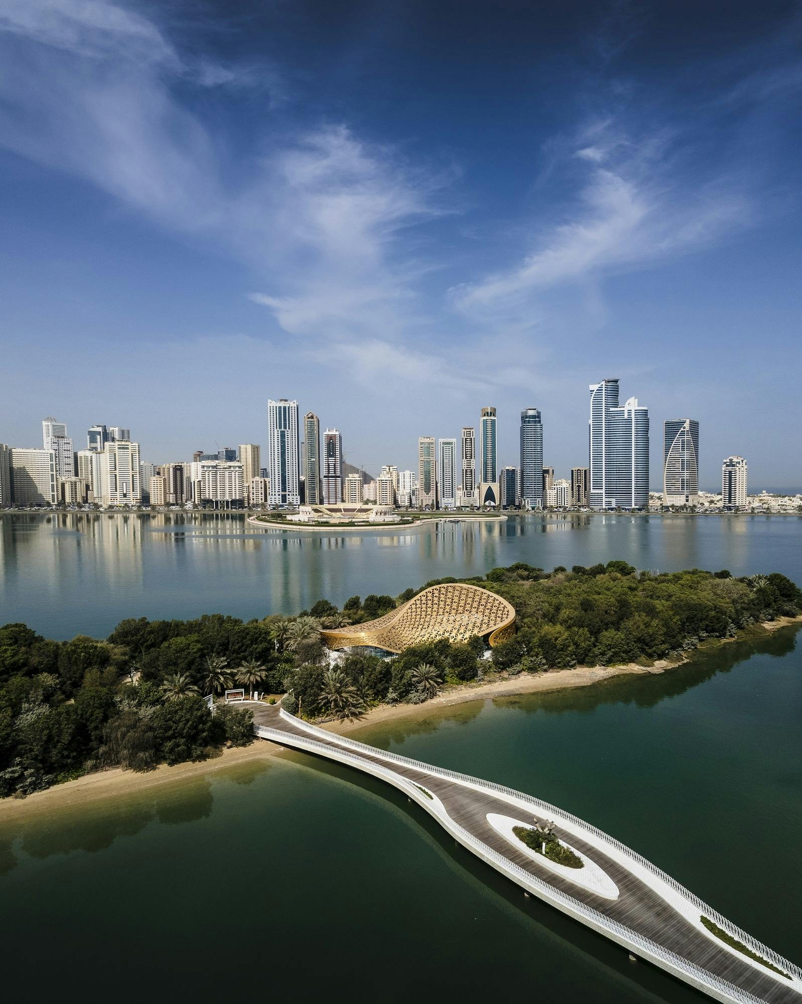 By the Bay, Al Noor Island skyline reflecting on water, ideal for upscale events and gatherings.