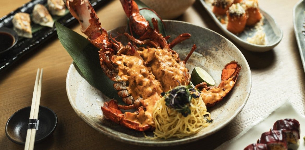 Lobster dish with noodles and herbs at Wakame restaurant for events and catering.