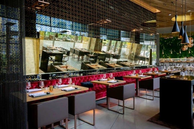 Modern sushi bar in Wakame, elegant seating for upscale private dinners and gatherings.