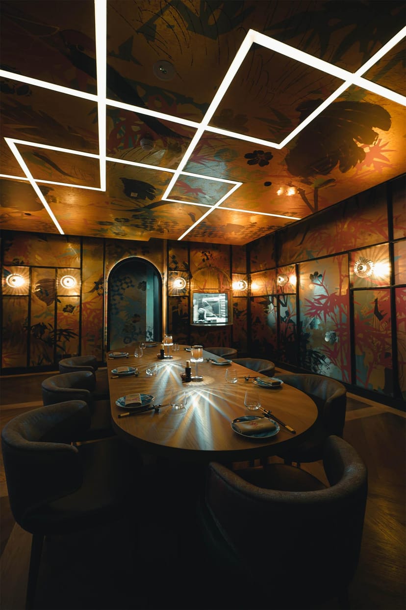 Intimate meeting room with vibrant decor for exclusive events and private dinners.