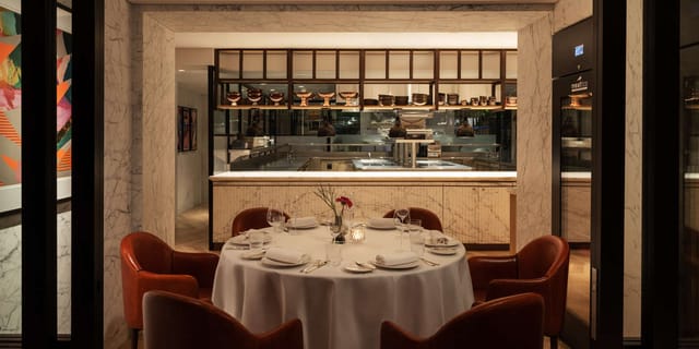 Elegant round table setup in Chef's Table restaurant for exclusive events and private dinners.