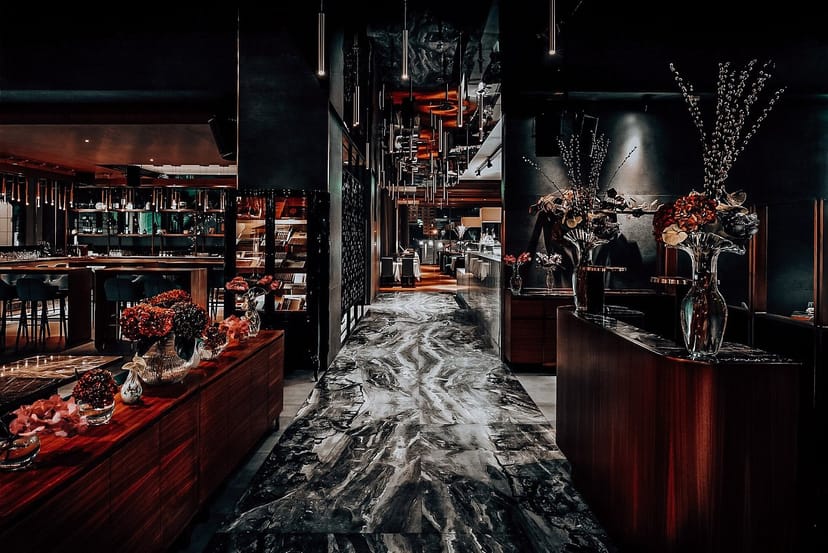 Sophisticated lounge bar with marble pathway, ideal for upscale events and gatherings.
