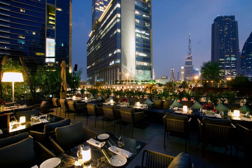 Sophisticated outdoor restaurant venue with elegant seating for corporate events.