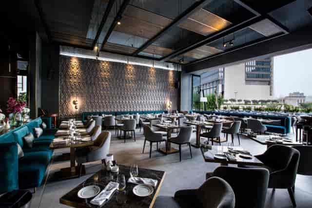 Sophisticated restaurant interior with elegant seating for upscale events and meetings.
