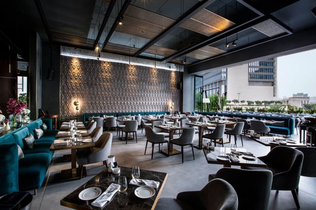 Sophisticated restaurant interior with elegant seating for upscale events and meetings.