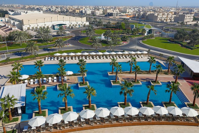 Outdoor swimming pool at Al Forsan Resort, ideal for corporate retreats and social events.