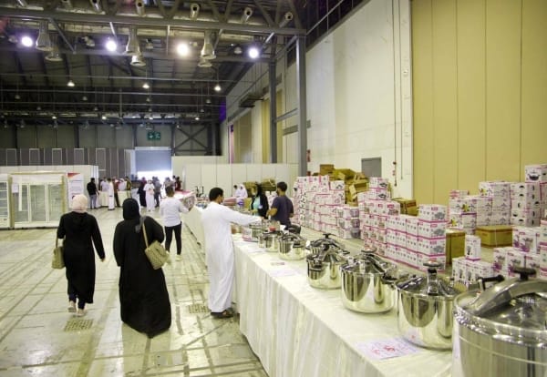 "Expo Centre Sharjah bustling event setup with organized food containers for catering."