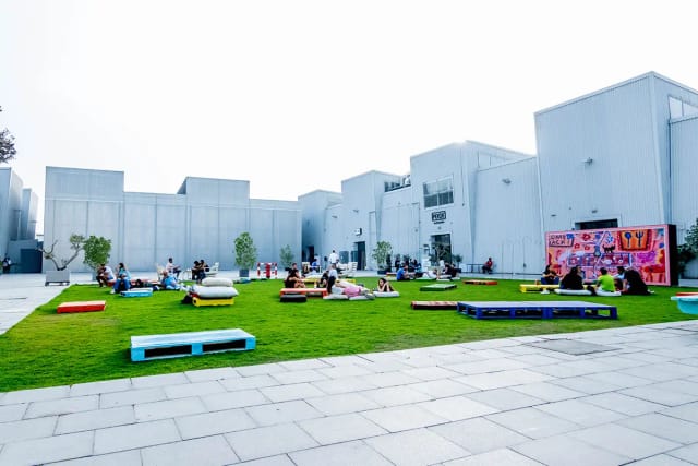 Vibrant outdoor event space in Alserkal Avenue with colorful seating for gatherings.