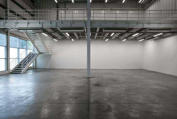 Versatile open event space in Alserkal Avenue with high ceilings for meetings and exhibitions.