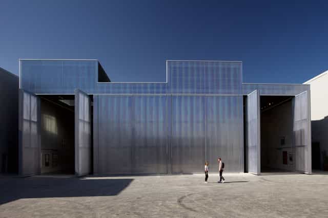 Modern industrial venue with glass facade in Alserkal Avenue for events and exhibitions.