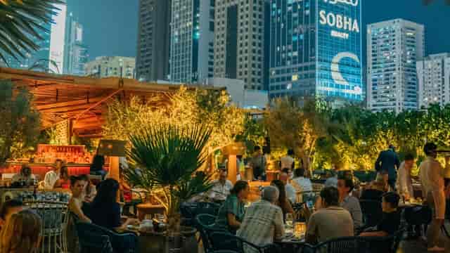 Brunch at La Cantine Du Faubourg, vibrant outdoor venue with lush greenery for events.