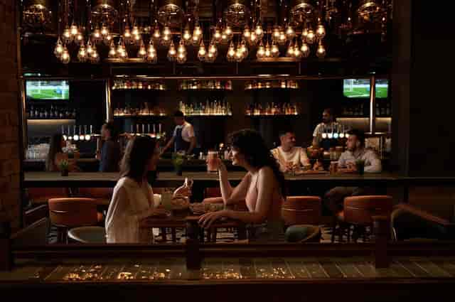 Vibrant bar booths in The Tap House, ideal for networking events and casual meetings.