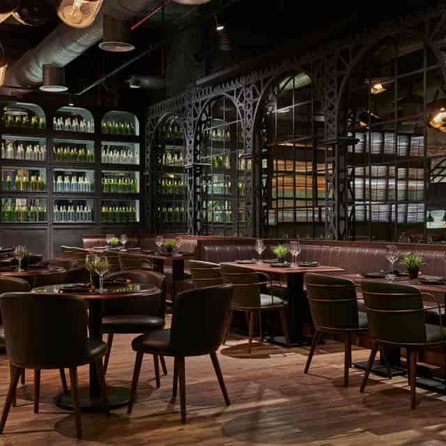 Stylish lounge with dark wood decor, ideal for upscale dinners and corporate events.