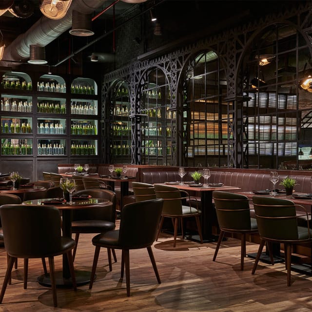 Stylish lounge with dark wood decor, ideal for upscale dinners and corporate events.