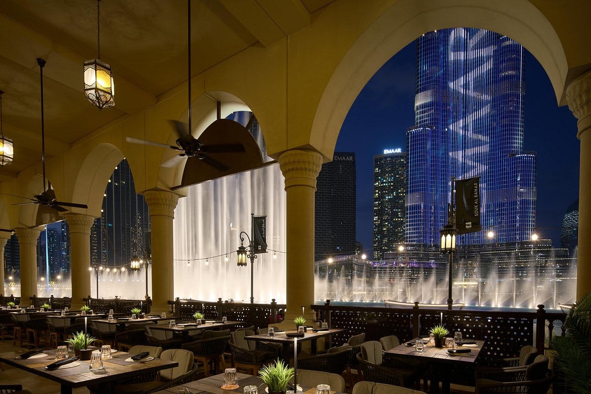 Elegant lounge with arches, fountain view, perfect for upscale events and gatherings.
