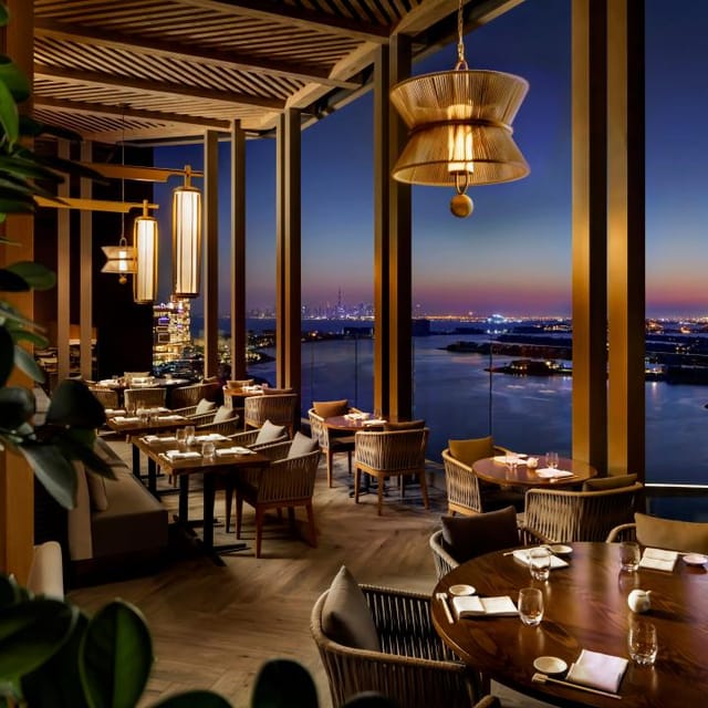 Sushi bar at Nobu Dubai with panoramic views, ideal for corporate events and gatherings.