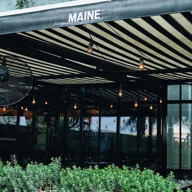 Land Brasserie at The MAINE DXB, modern venue with exposed bulbs, perfect for networking events.