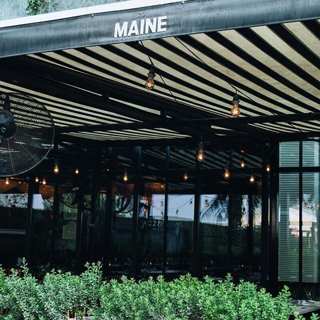 Land Brasserie at The MAINE DXB, modern venue with exposed bulbs, perfect for networking events.