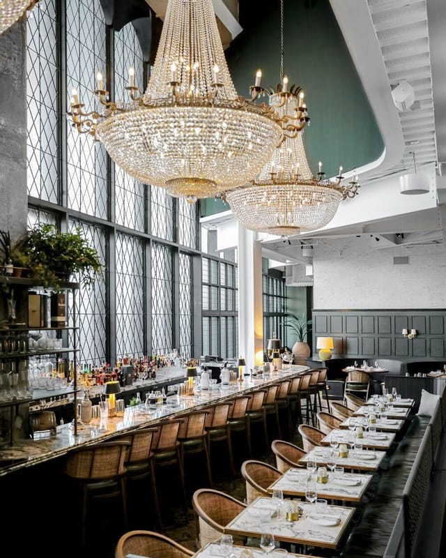 Oyster Bar & Grill event space with elegant chandeliers for upscale gatherings in Dubai.