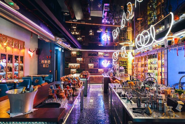 Vibrant cocktail bar with modern decor, perfect for networking events and receptions.
