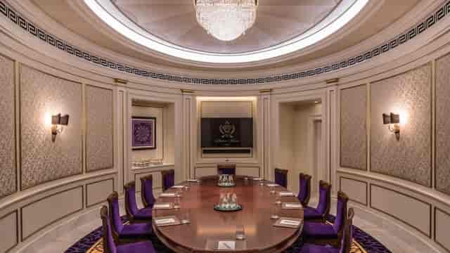 Executive meeting room at Palazzo Versace Dubai with elegant round table and luxury decor.