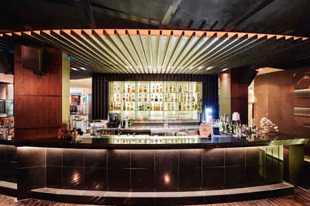 Tatami Terrace bar at Raffles Dubai, sleek design for cocktail receptions and networking.
