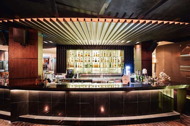 Tatami Terrace bar at Raffles Dubai, sleek design for cocktail receptions and networking.