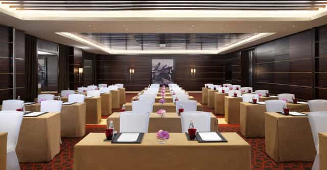 Meeting room in Raffles Dubai with elegant decor, ideal for corporate events and workshops.