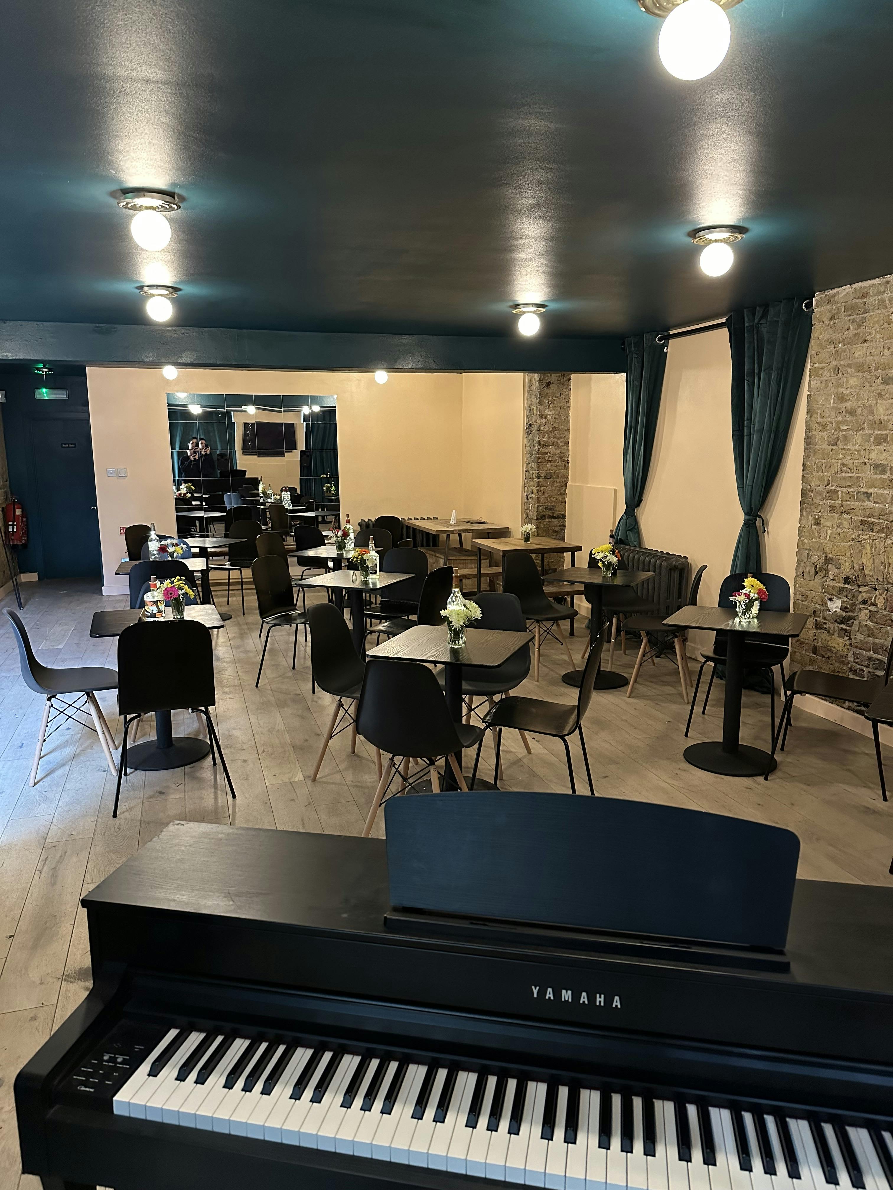 Versatile event space with modern decor, ideal for gatherings and networking events.
