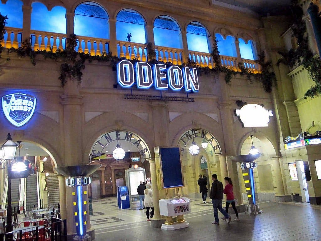 ODEON Trafford Centre entrance, illuminated sign, ideal for film screenings and events.