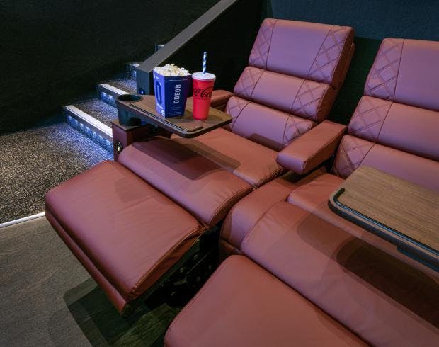 Luxurious recliners in ODEON Norwich private screening room for exclusive events.