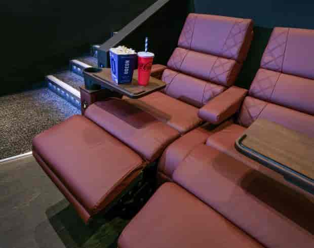 Luxurious recliners in ODEON Norwich private screening room for exclusive events.