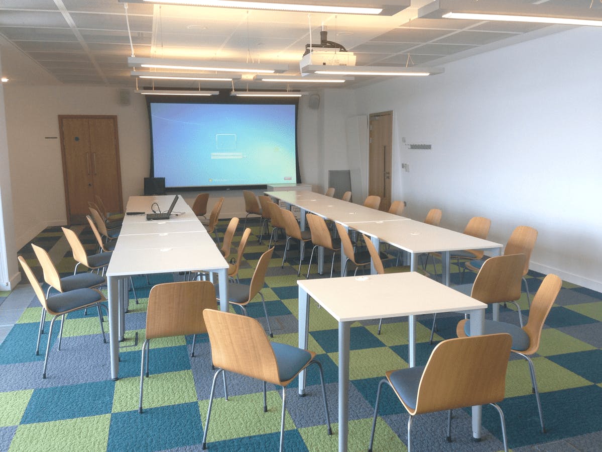 Meeting Room 3 at Canada Water Library with central table for collaborative meetings.