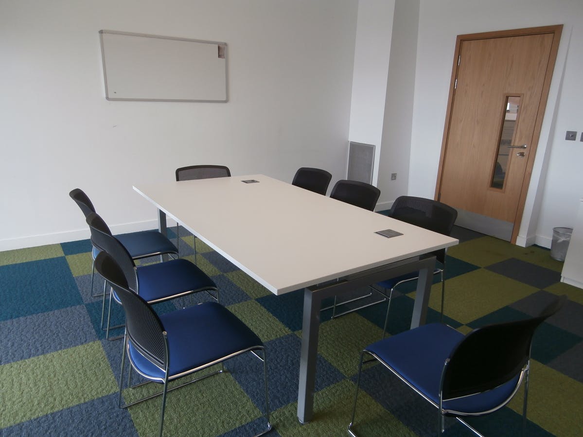 Modern meeting room with rectangular table, ideal for professional discussions in Southwark.