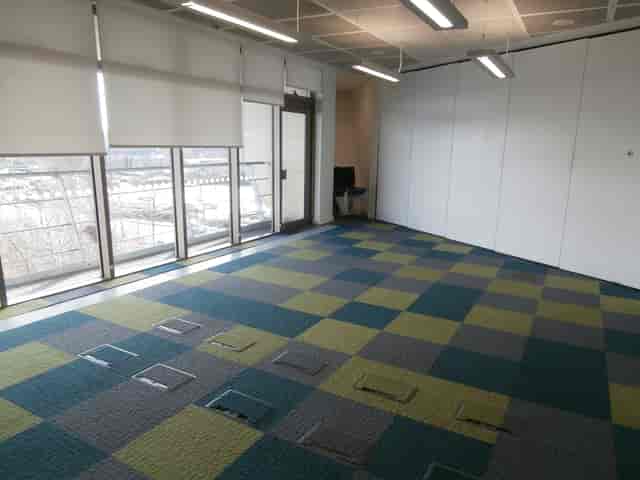 Versatile Meeting Room 5 at Canada Water Library, bright with large windows for events.