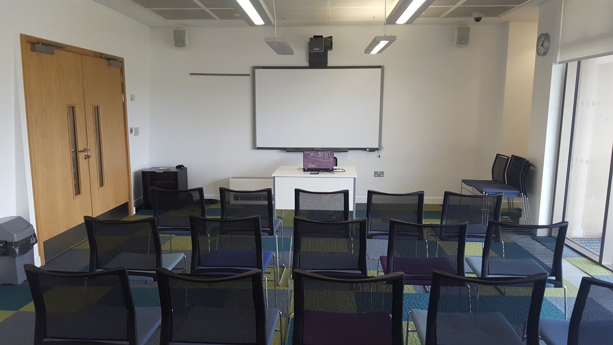 Meeting Room 5 at Canada Water Library, organized for presentations with black chairs.