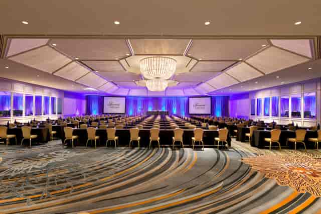 Elegant Cuvee Room at Fairmont Chicago, ideal for corporate events with purple lighting.