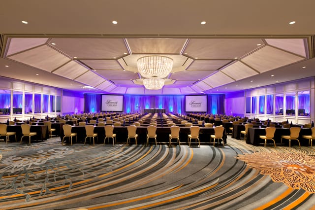Elegant Cuvee Room at Fairmont Chicago, ideal for corporate events with purple lighting.