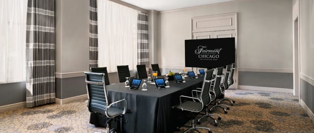 Cuvee Room at Fairmont Chicago: modern corporate meeting space with tablets and elegant decor.