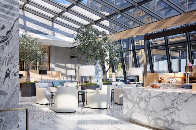 Elegant Ritz-Carlton Chicago suite with natural light, perfect for networking events.