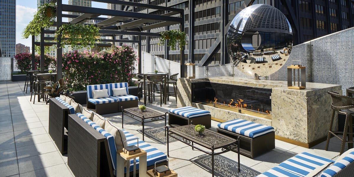 Stylish outdoor event space at The Ritz-Carlton, Chicago with modern seating and greenery.