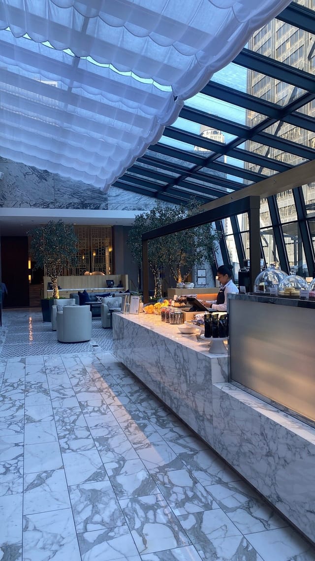 Rooftop bar at The Ritz-Carlton, Chicago with elegant marble counter for events.