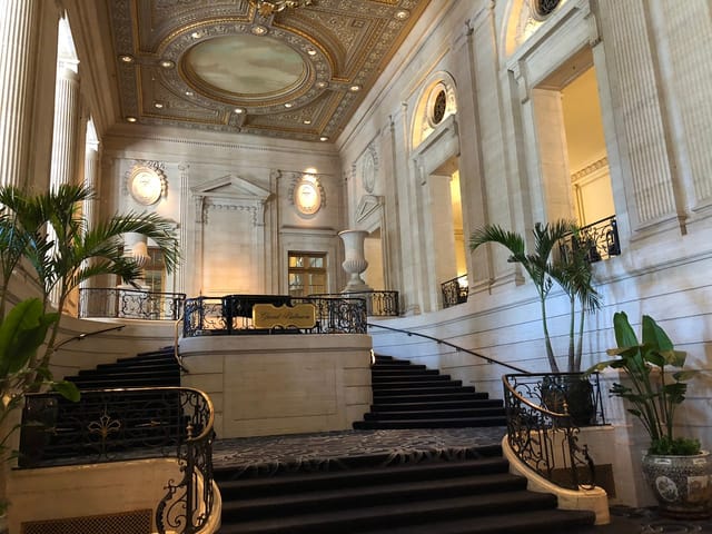 Elegant Hilton Chicago ballroom with grand staircase, perfect for galas and corporate events.