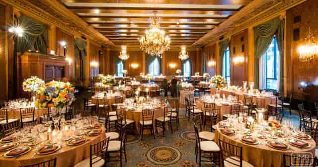 Elegant banquet hall with floral centerpieces for upscale weddings and galas.