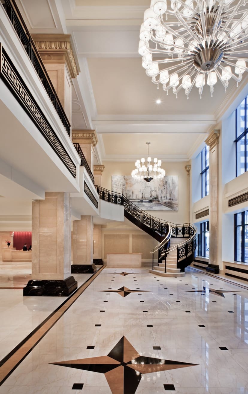 Elegant JW Marriott Chicago lobby with grand staircase, ideal for upscale events.