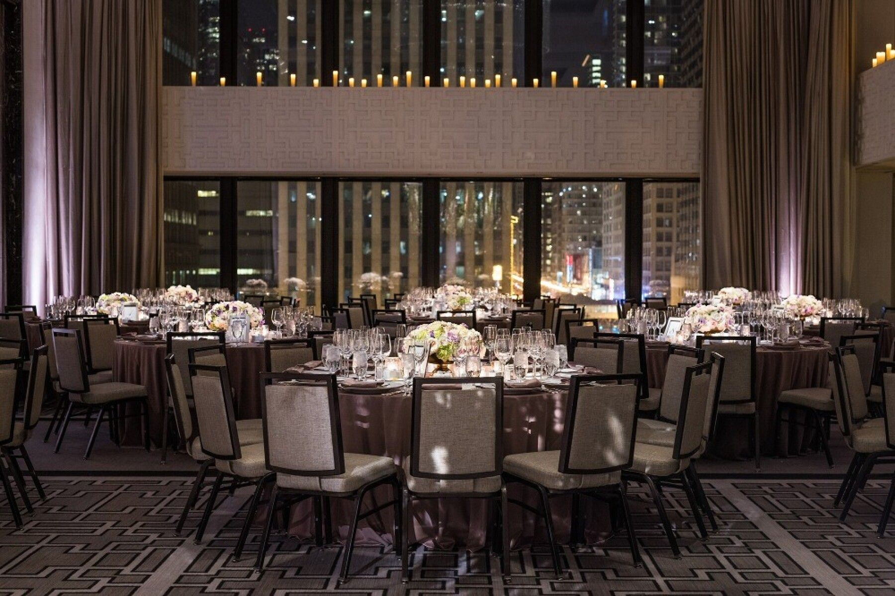 Elegant Devonshire Ballroom banquet setup with floral centerpieces for upscale events.