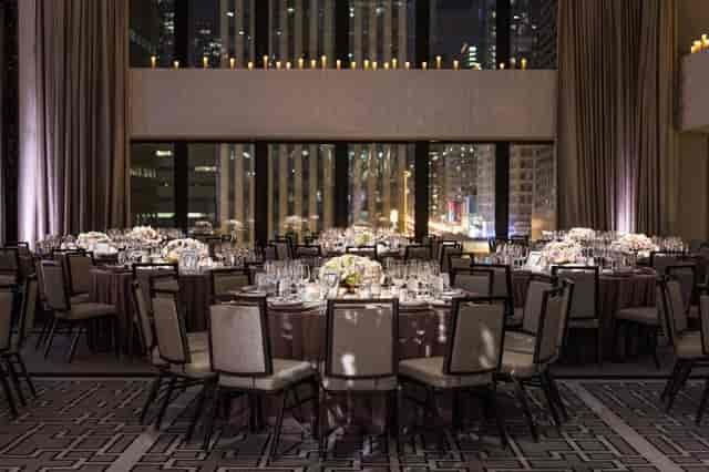 Elegant Devonshire Ballroom banquet setup with floral centerpieces for upscale events.