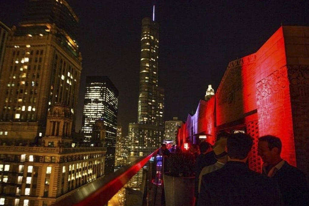 Rooftop lounge at Virgin Hotels Chicago, illuminated venue for upscale events and gatherings.