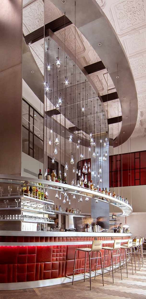 Modern bar in Virgin Hotels Chicago with elegant pendant lighting for cocktail receptions.